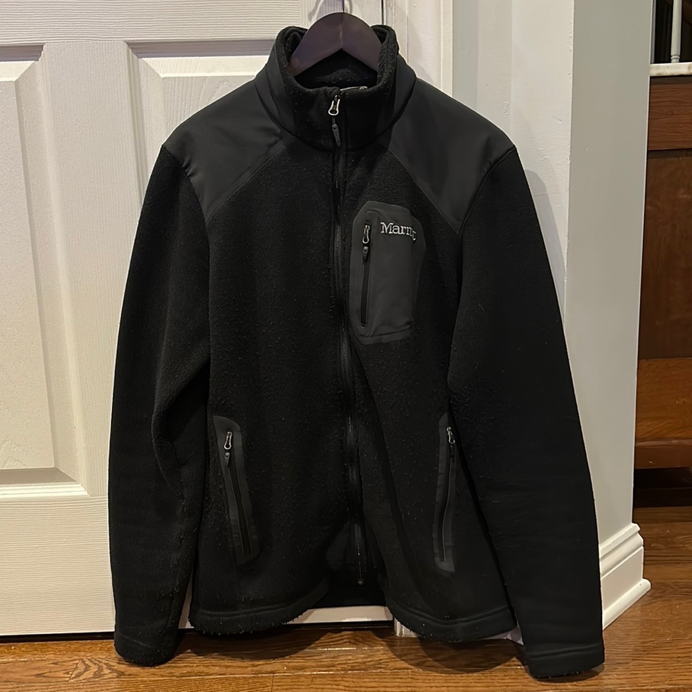 Men’s MARMOT used black fleece jacket. 3 zippered pockets, no hood